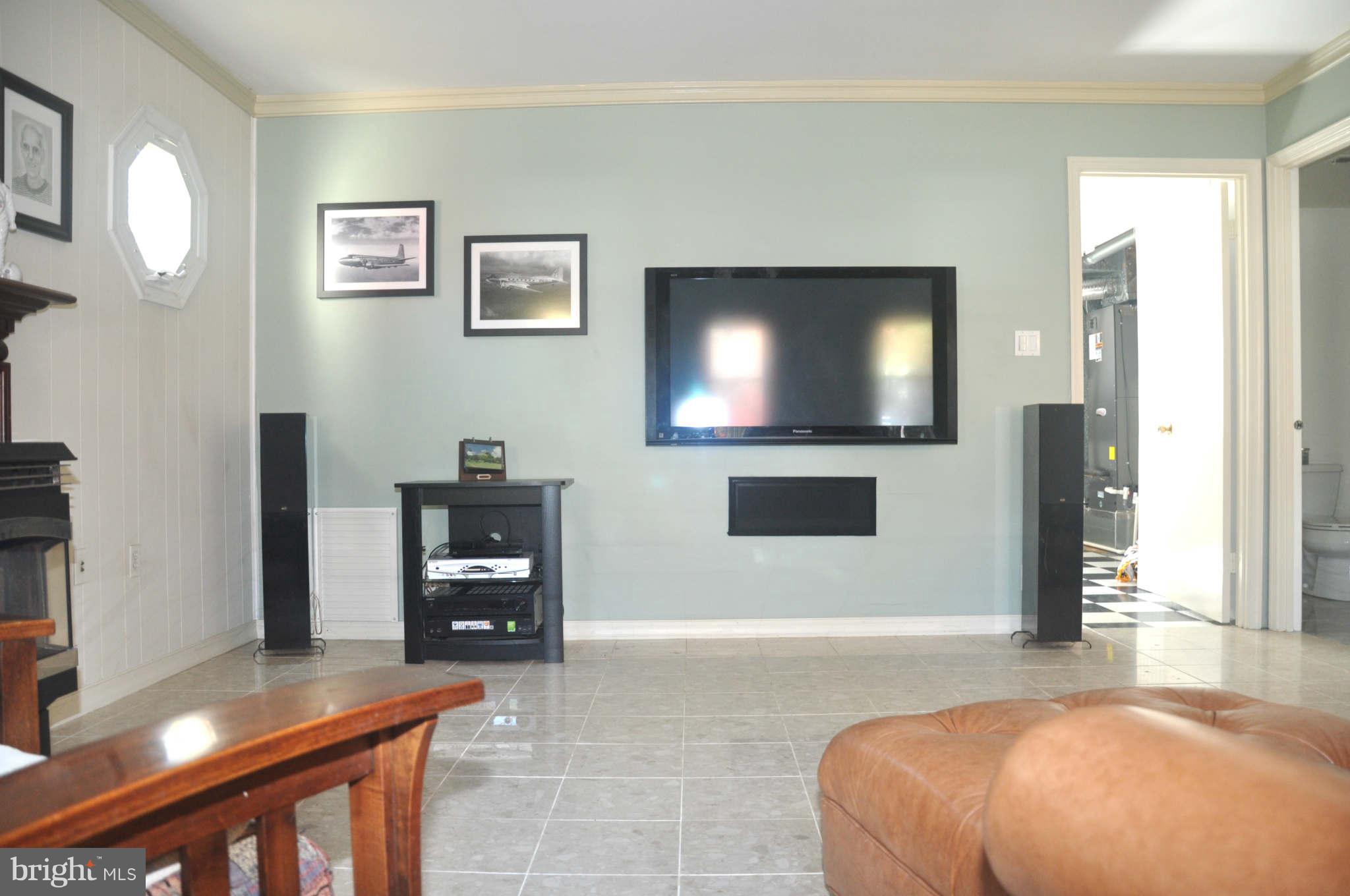 12405 Melmark Court Reston, VA 20191 - Photo 23 of 30 a bedroom with a bed and a flat screen tv