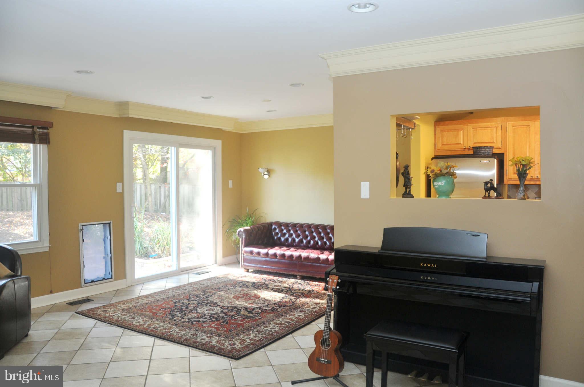 12405 Melmark Court Reston, VA 20191 - Photo 24 of 30 a living room with a couch and large windows