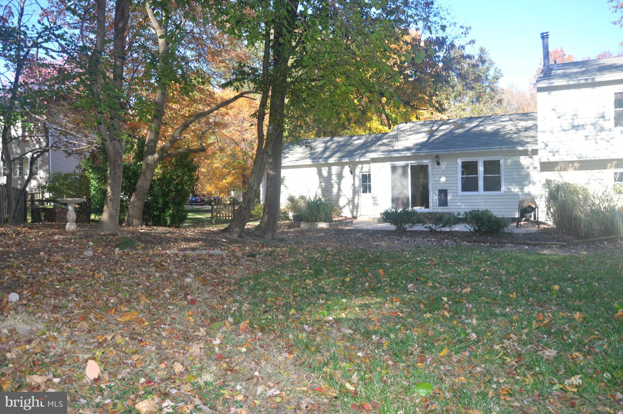 12405 Melmark Court Reston, VA 20191 - Photo 29 of 30 a front view of house with yard and green space