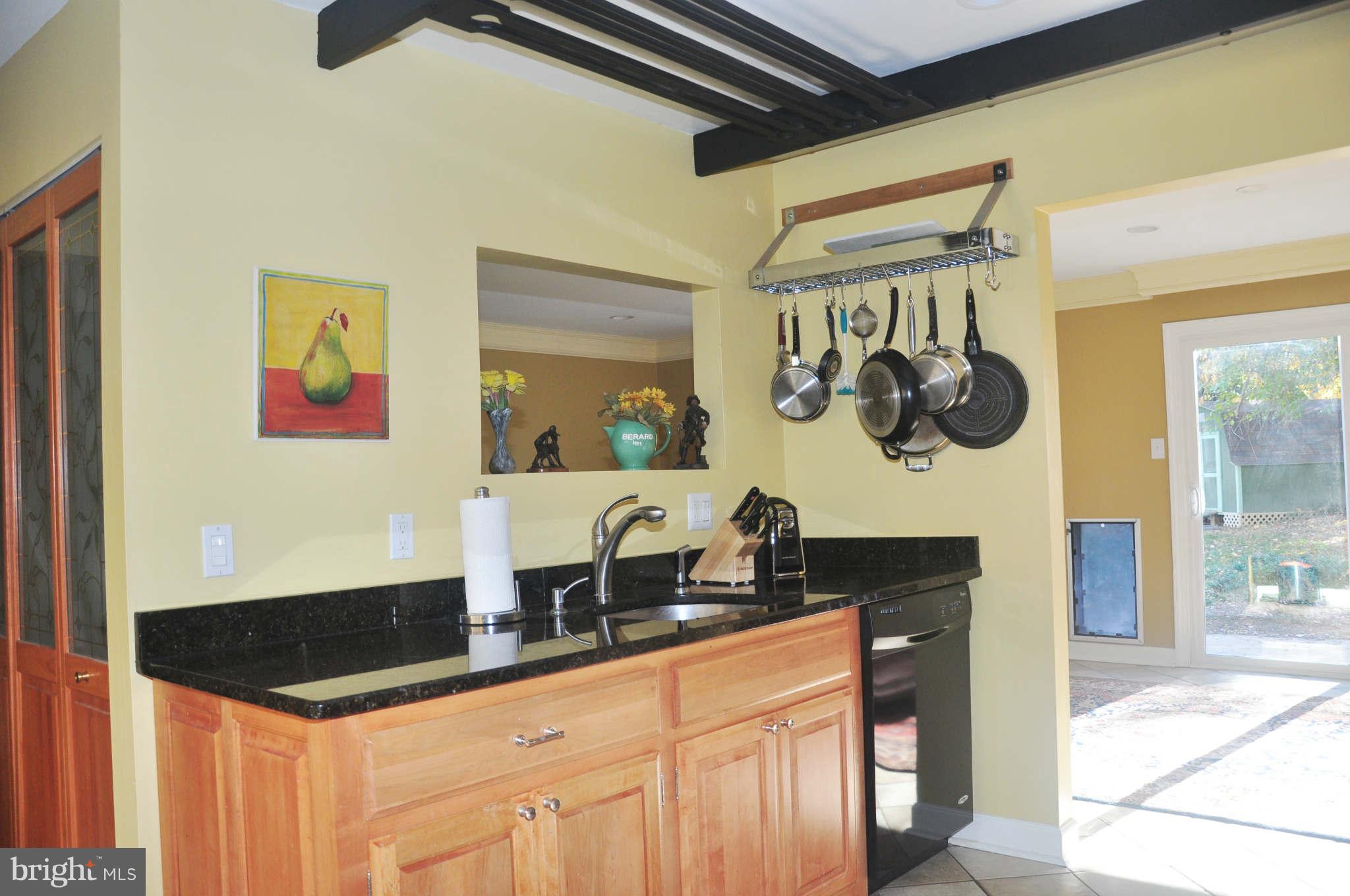 12405 Melmark Court Reston, VA 20191 - Photo 5 of 30 a kitchen with a sink a stove top oven and cabinets