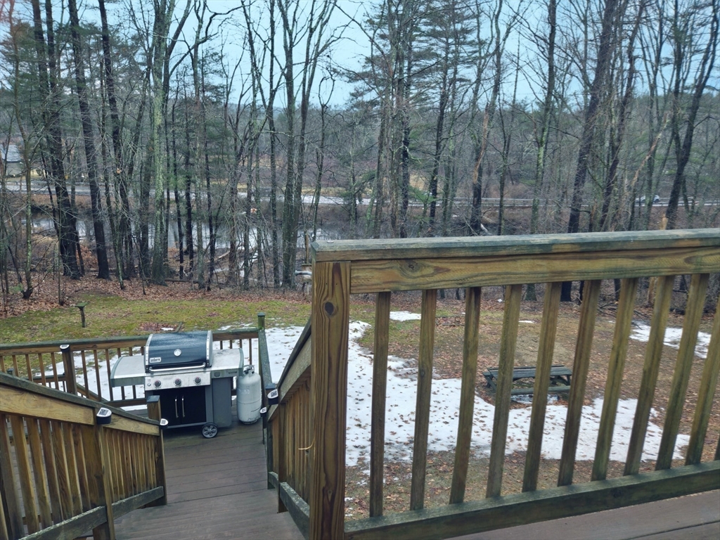 35 Pine Ridge Drive Oxford, MA 01540 - Photo 16 of 19 a view of a roof deck with wooden fence and a couple of chairs