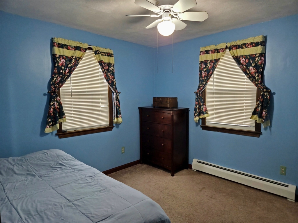 35 Pine Ridge Drive Oxford, MA 01540 - Photo 9 of 19 a bedroom with a bed and a window