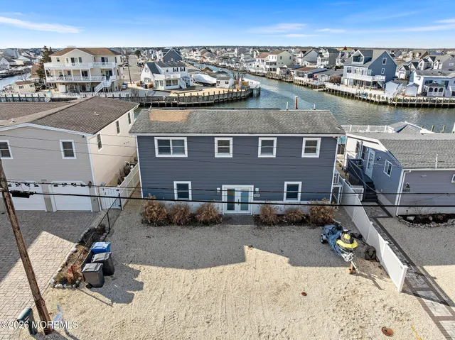 an aerial view of a house with a swimming pool