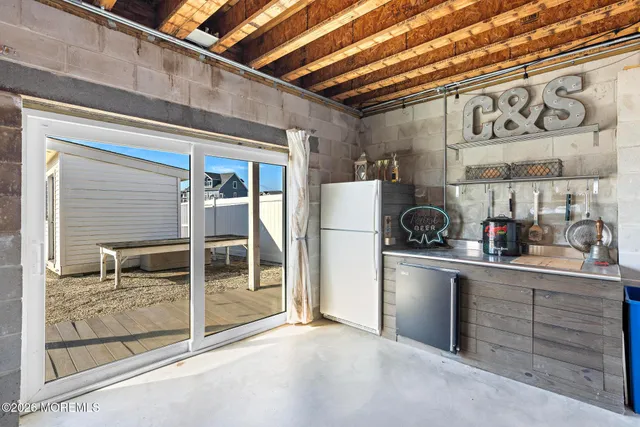 a kitchen with stainless steel appliances granite countertop a refrigerator and cabinets