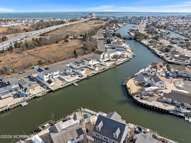 an aerial view of a city with a lake view