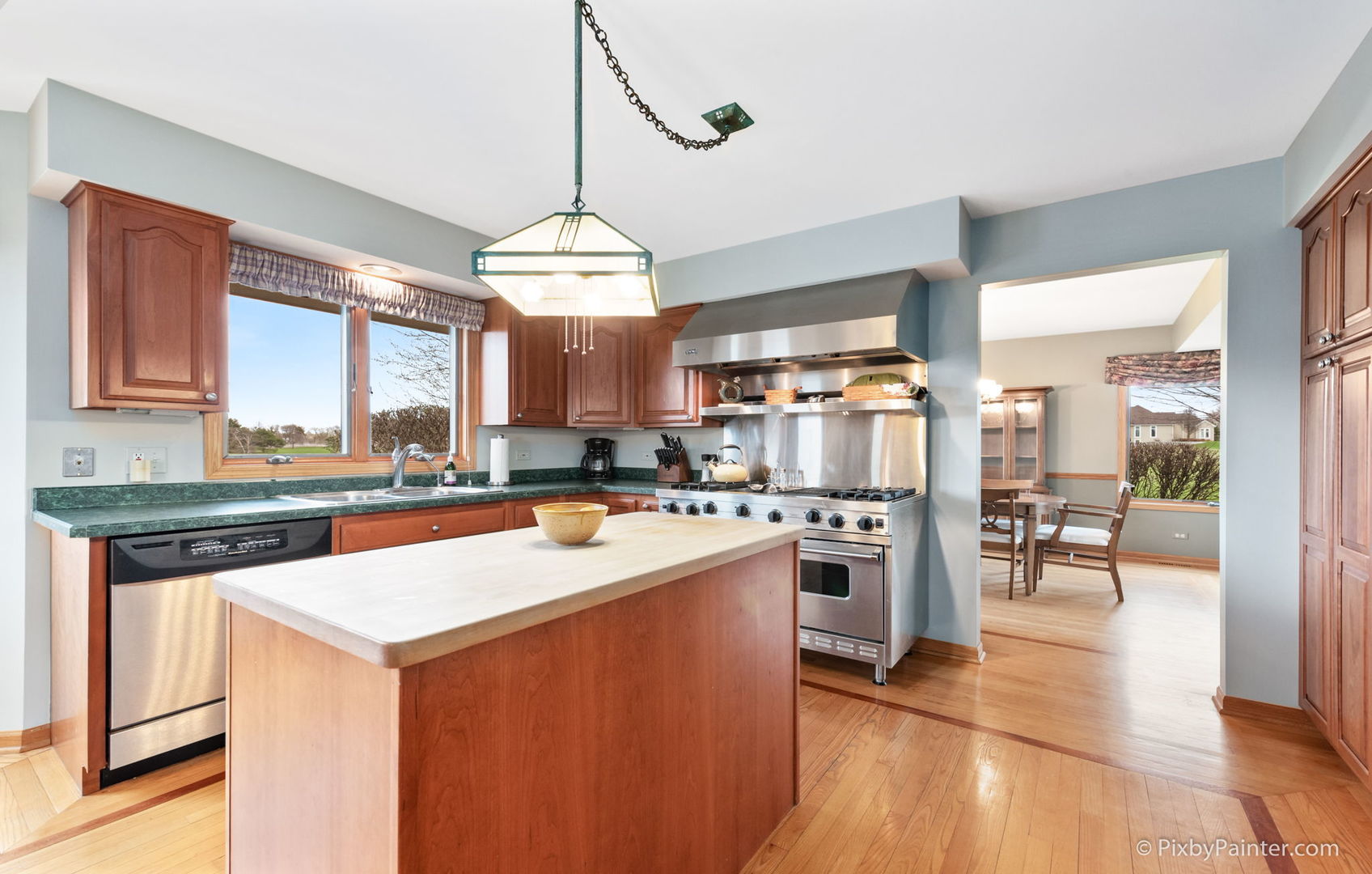 8214 Harmony Hill Road Marengo, IL 60152 - Photo 13 of 34 a kitchen with stainless steel appliances granite countertop a stove top oven a sink and a refrigerator