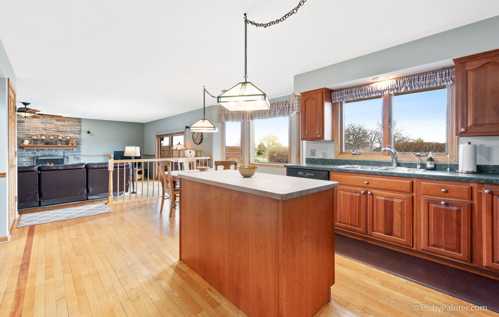 8214 Harmony Hill Road Marengo, IL 60152 - Photo 14 of 34 a large kitchen with kitchen island granite countertop wooden cabinets a counter space a sink and appliances