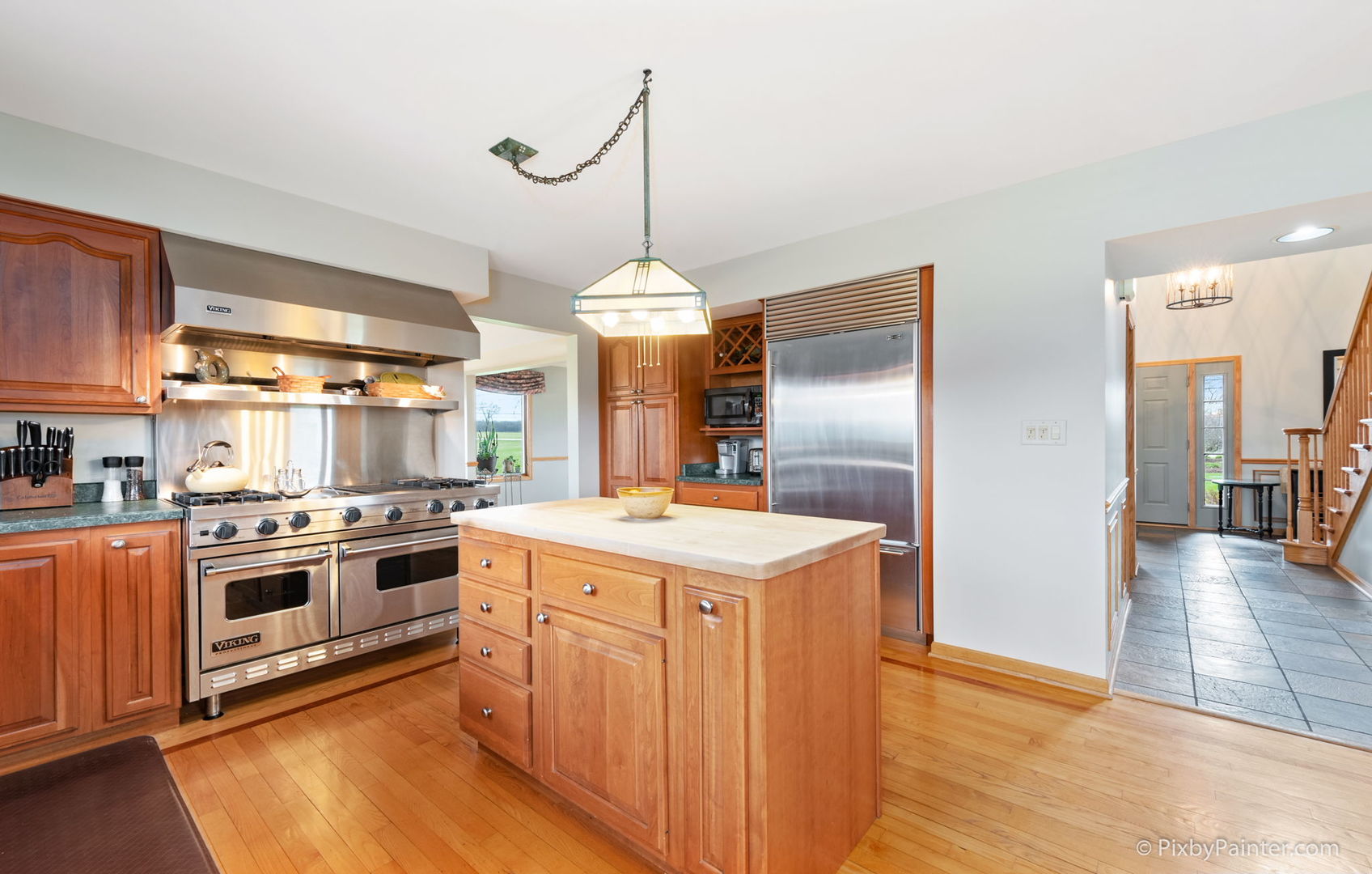 8214 Harmony Hill Road Marengo, IL 60152 - Photo 15 of 34 a kitchen with stainless steel appliances granite countertop a stove and a refrigerator
