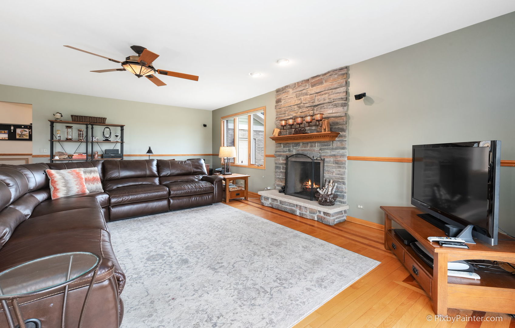 8214 Harmony Hill Road Marengo, IL 60152 - Photo 16 of 34 a living room with furniture flat screen tv and a fireplace