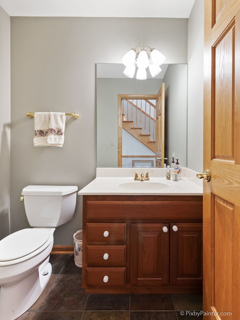8214 Harmony Hill Road Marengo, IL 60152 - Photo 19 of 34 a bathroom with a toilet a sink and a mirror