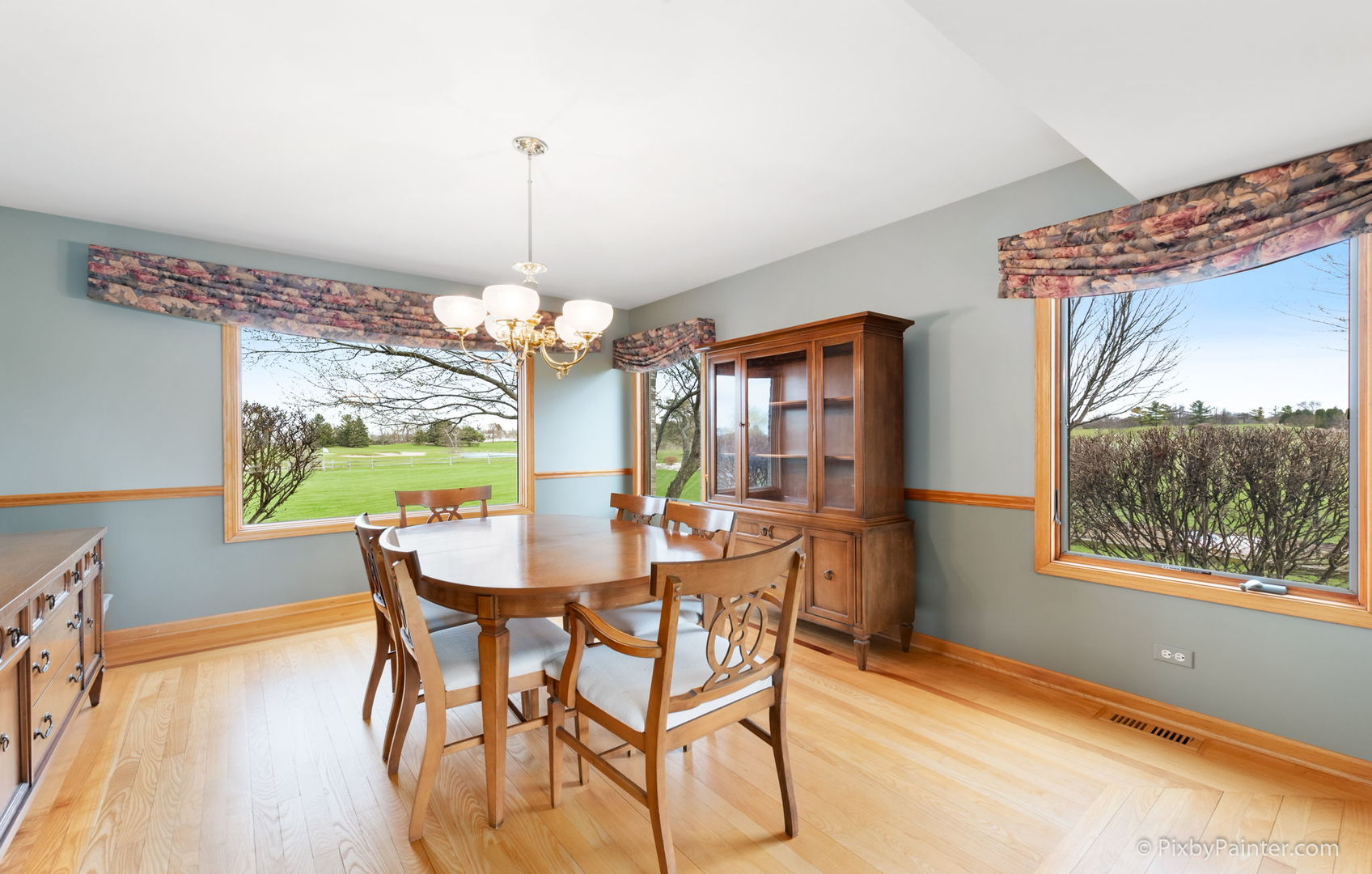8214 Harmony Hill Road Marengo, IL 60152 - Photo 9 of 34 a view of a dining room with furniture a chandelier and wooden floor