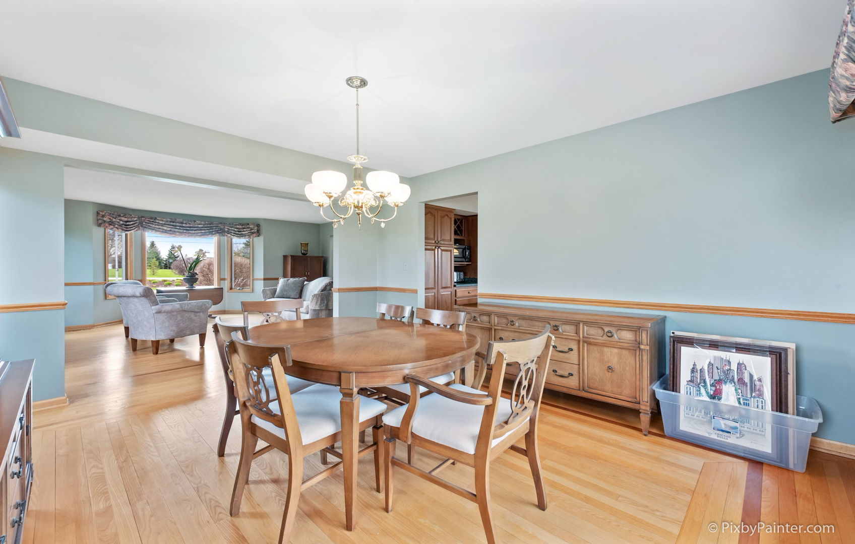 8214 Harmony Hill Road Marengo, IL 60152 - Photo 10 of 34 a view of a dining room with furniture wooden floor and chandelier