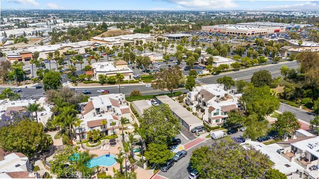 a view of a house with large windows and a small yard