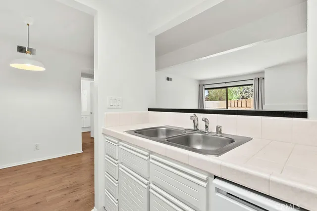 a bathroom with a toilet a sink and a mirror