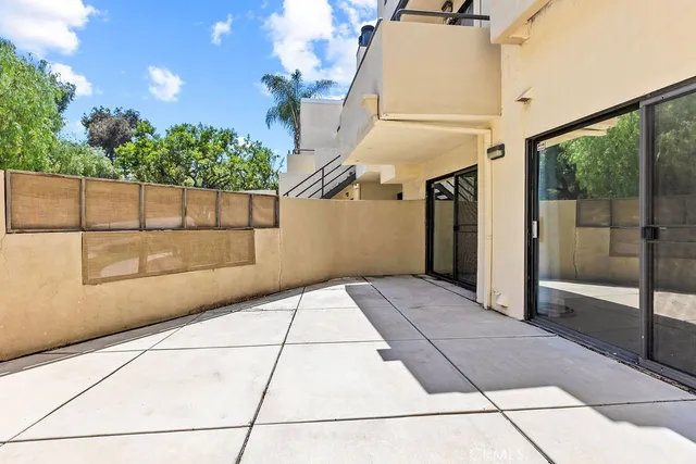 a view of a swimming pool with outdoor seating