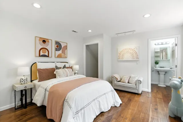 a bedroom with furniture and a window