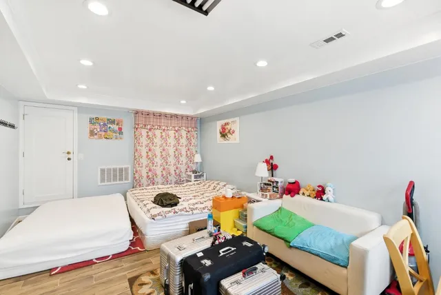 a bedroom with a bed and a dresser