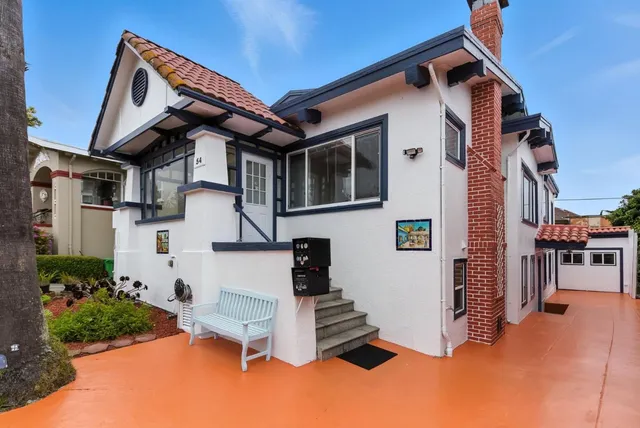 a room with furniture and large windows