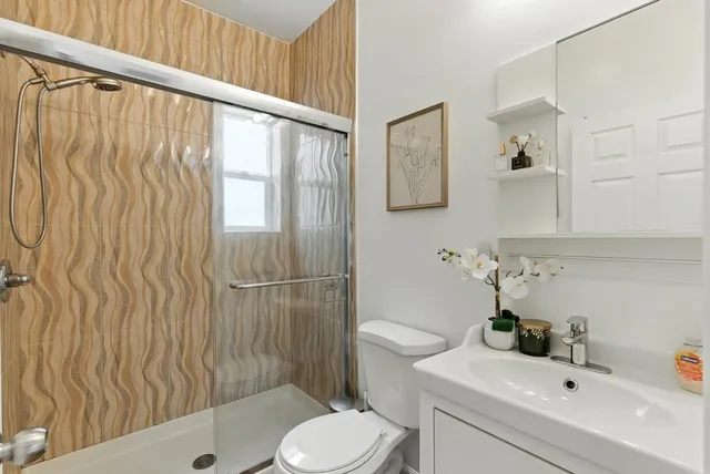 a kitchen with sink a stove and cabinets