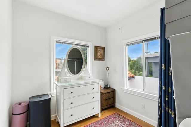 an aerial view of residential houses with city view
