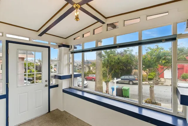 a view of a dining room with furniture wooden floor and chandelier
