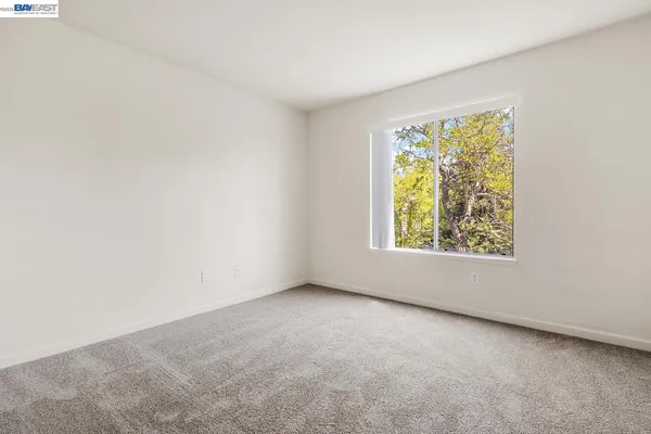 a view of house with outdoor space and sitting area