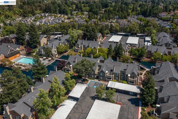 an aerial view of a house with a yard