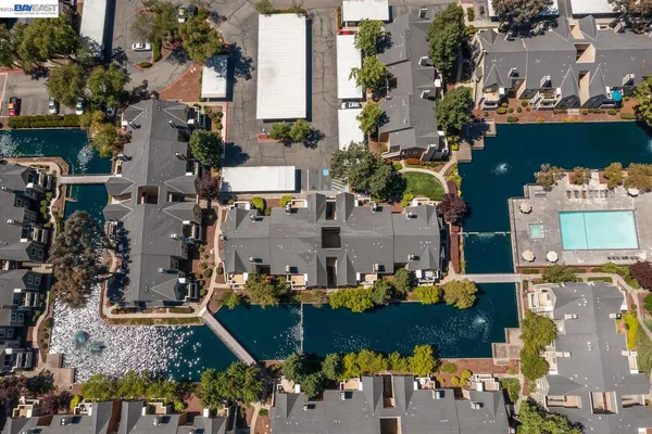 an empty room with a fireplace and a large window