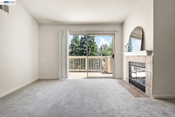 a view of yard with swimming pool and trees in the background