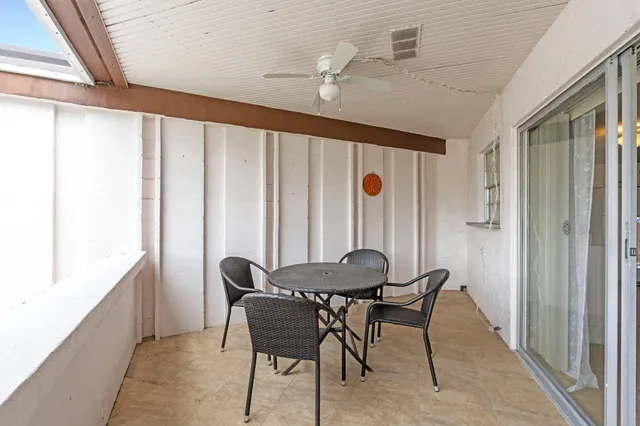 a view of a room that has a bed and a large window