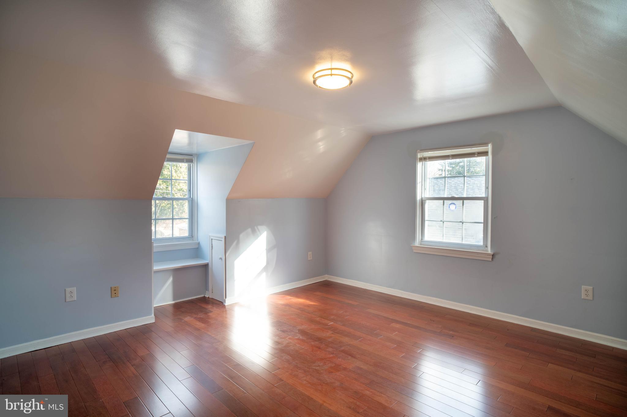11 Wharton Lane Cheltenham, PA 19012 - Photo 15 of 17 an empty room with wooden floor and windows