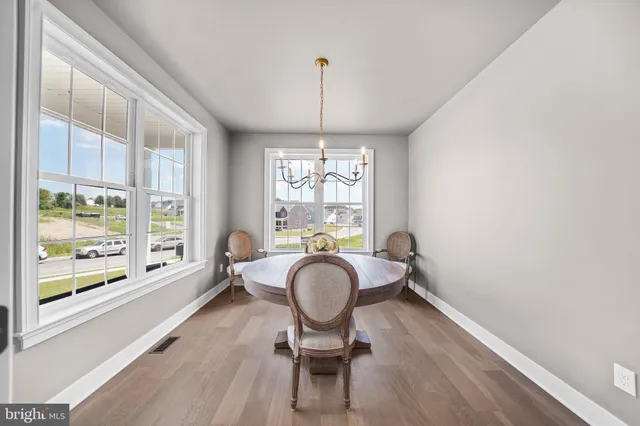 a view of a dining room with furniture window and outside view