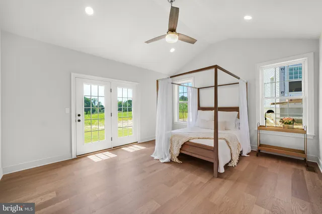 a spacious bathroom with a shower sink and mirror