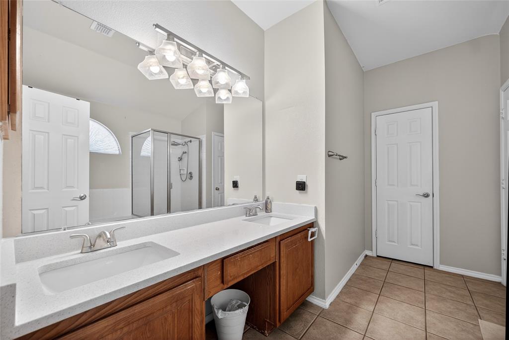 9633 Anns Way Plano, TX 75025 - Photo 19 of 37 a bathroom with a sink double vanity granite and a mirror