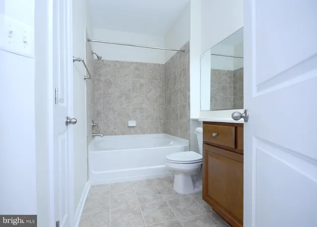 a bathroom with a toilet a sink and bathtub