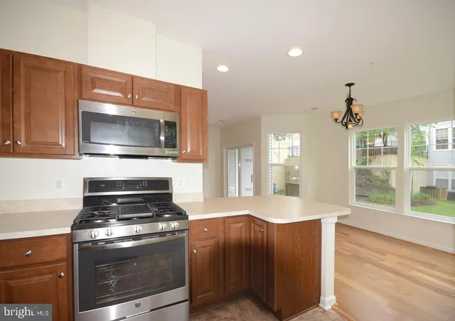 a kitchen with a stove and a microwave