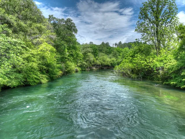 a view of a lake with a building in the background