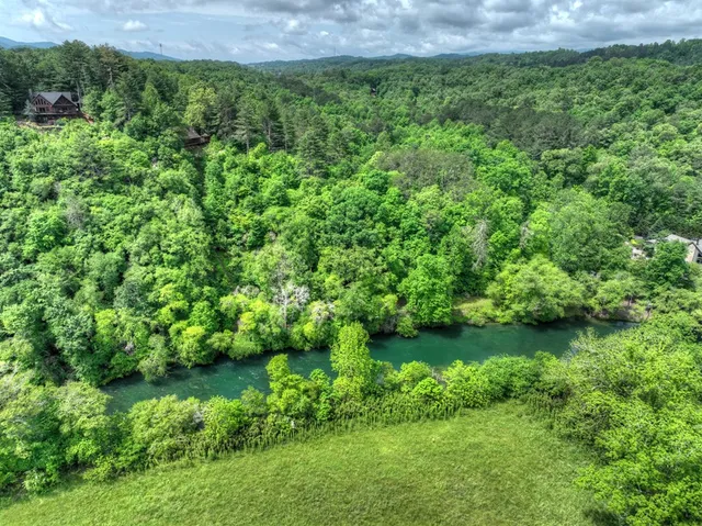 a view of a lake with a yard