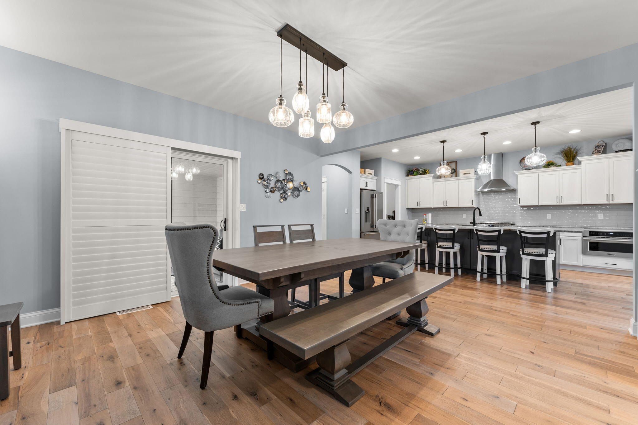 5956 Beacon Lane Portage, IN 46368 - Photo 18 of 57 a view of a dining room with furniture and wooden floor