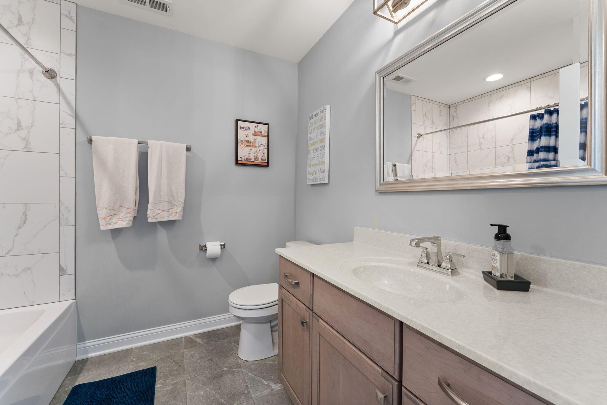 5956 Beacon Lane Portage, IN 46368 - Photo 27 of 57 a bathroom with a sink toilet and a mirror