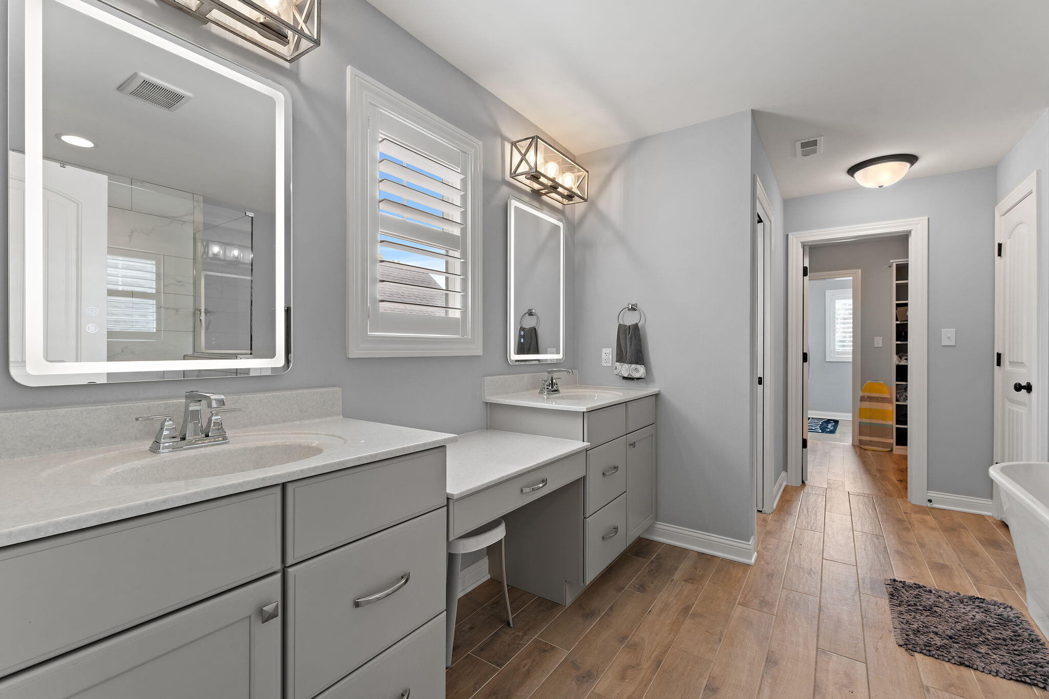 5956 Beacon Lane Portage, IN 46368 - Photo 32 of 57 a spacious bathroom with a double vanity sink a mirror and a shower