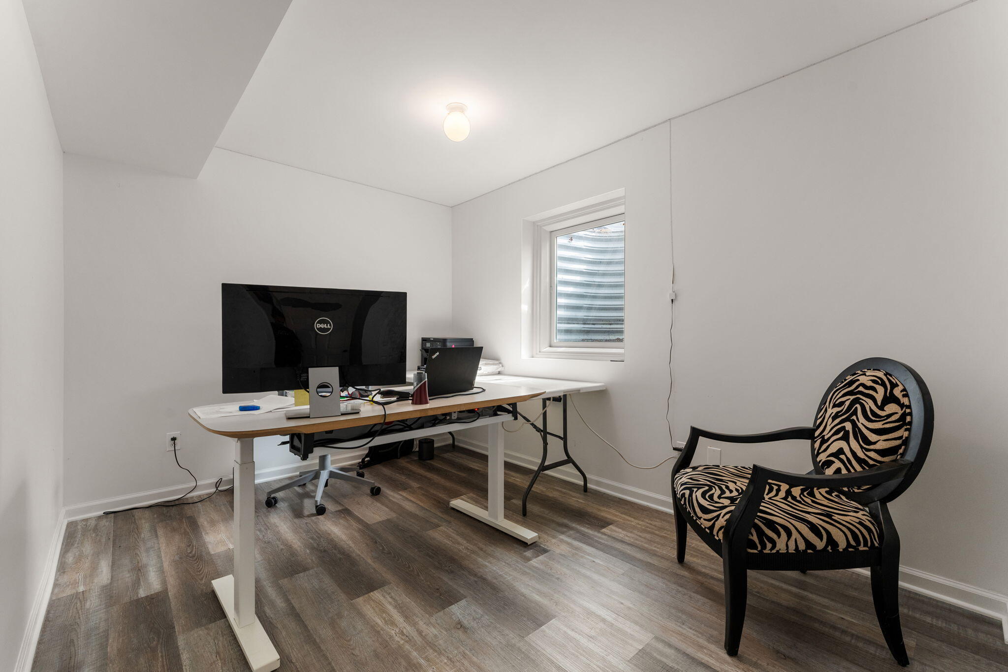 5956 Beacon Lane Portage, IN 46368 - Photo 39 of 57 a view of a workspace with furniture and a window