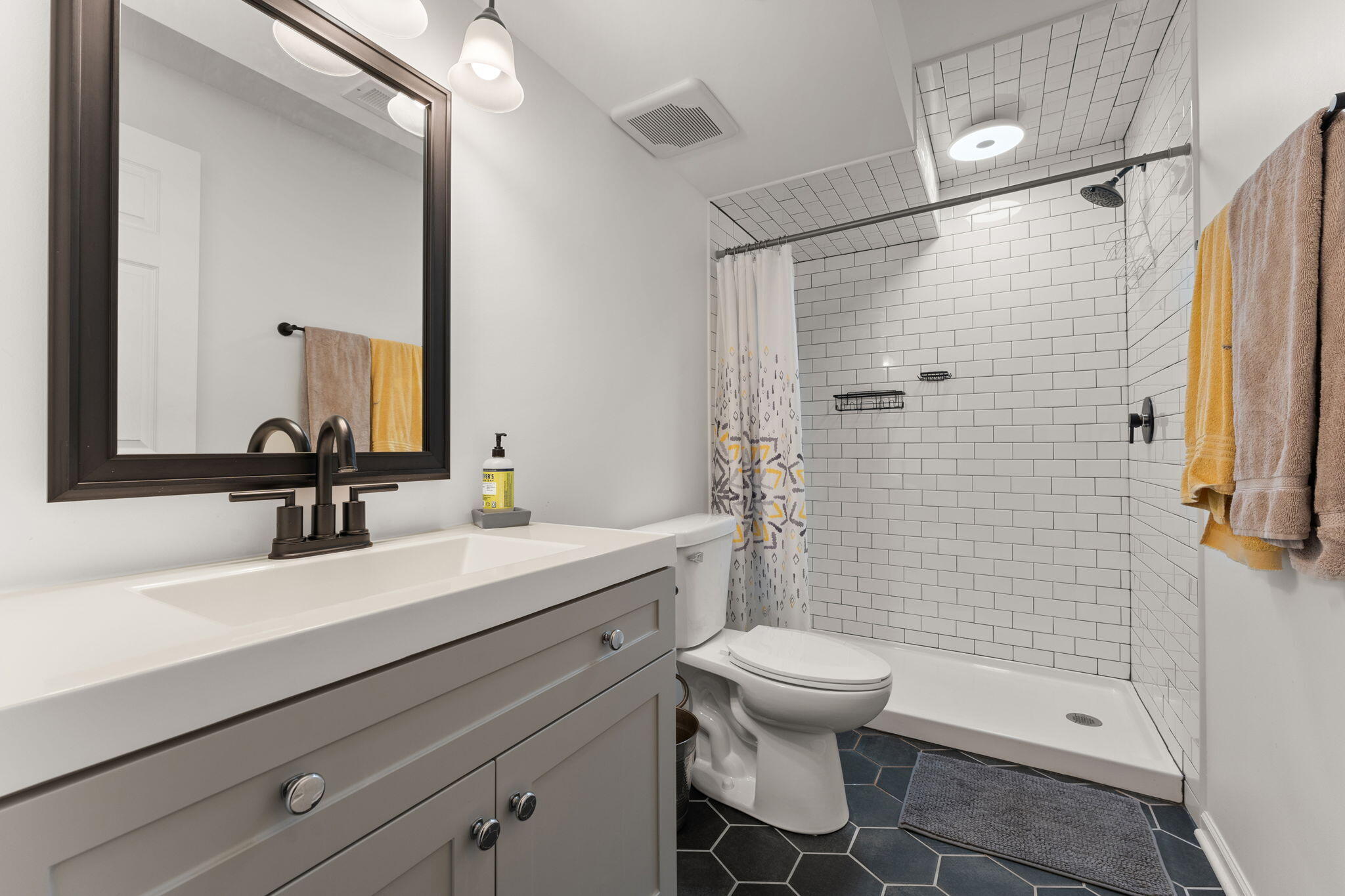 5956 Beacon Lane Portage, IN 46368 - Photo 40 of 57 a bathroom with a sink a toilet and shower