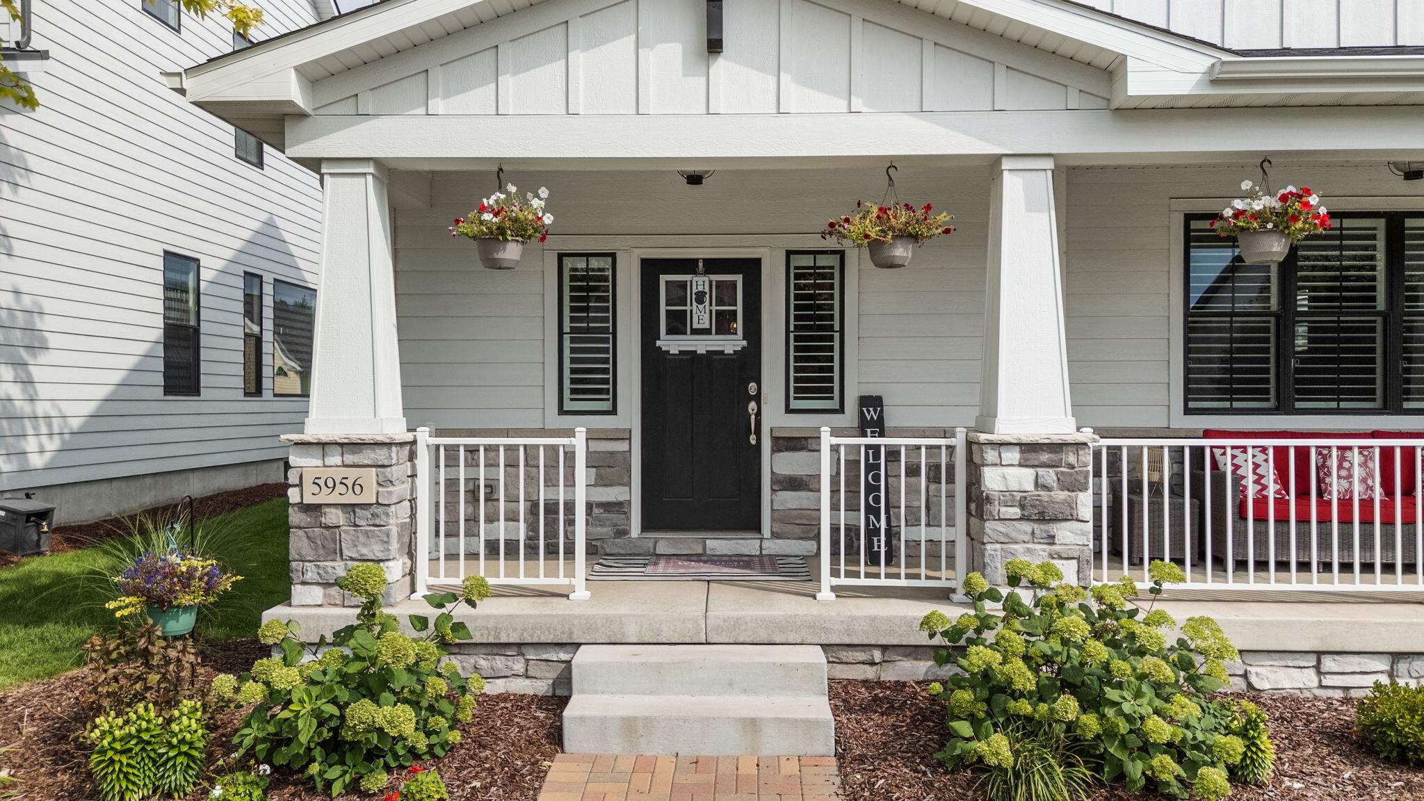 5956 Beacon Lane Portage, IN 46368 - Photo 5 of 57 a front view of a house with a garden