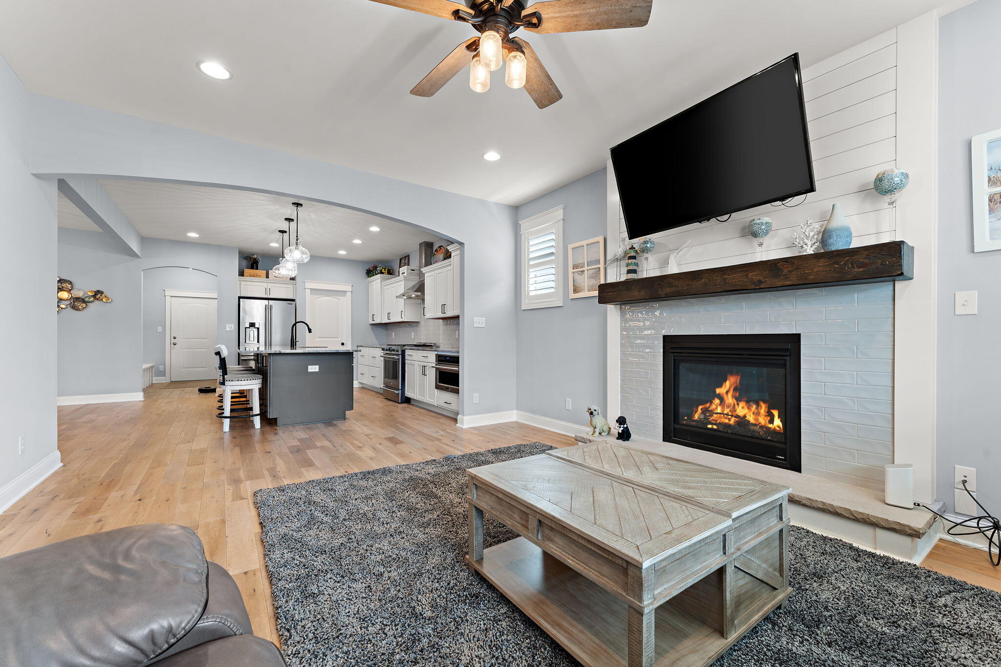5956 Beacon Lane Portage, IN 46368 - Photo 9 of 57 a living room with furniture a flat screen tv and a fireplace