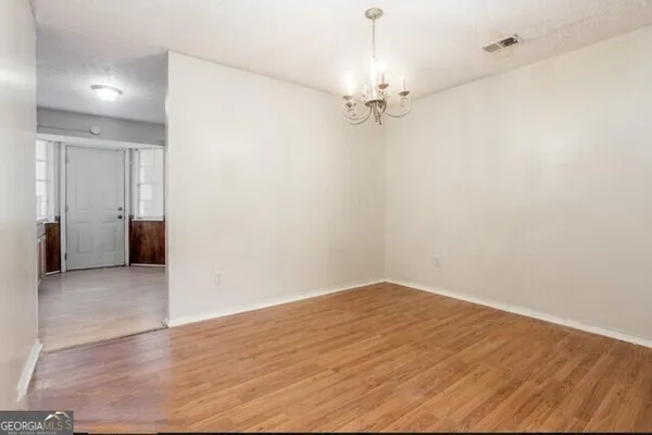 an empty room with a bathroom
