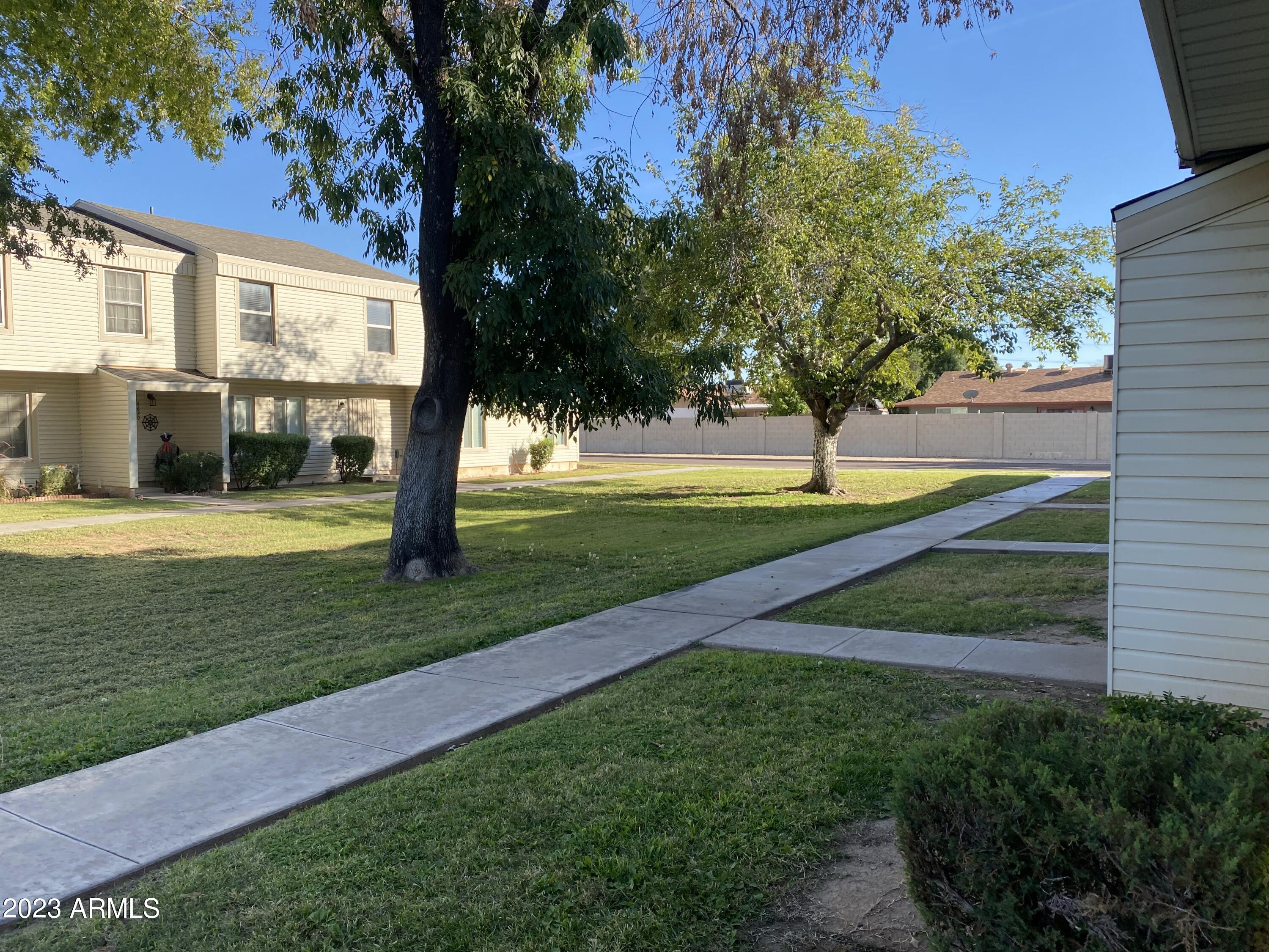 6617 South Granada Drive Tempe, AZ 85283 - Photo 1 of 20 a view of a house with a big yard