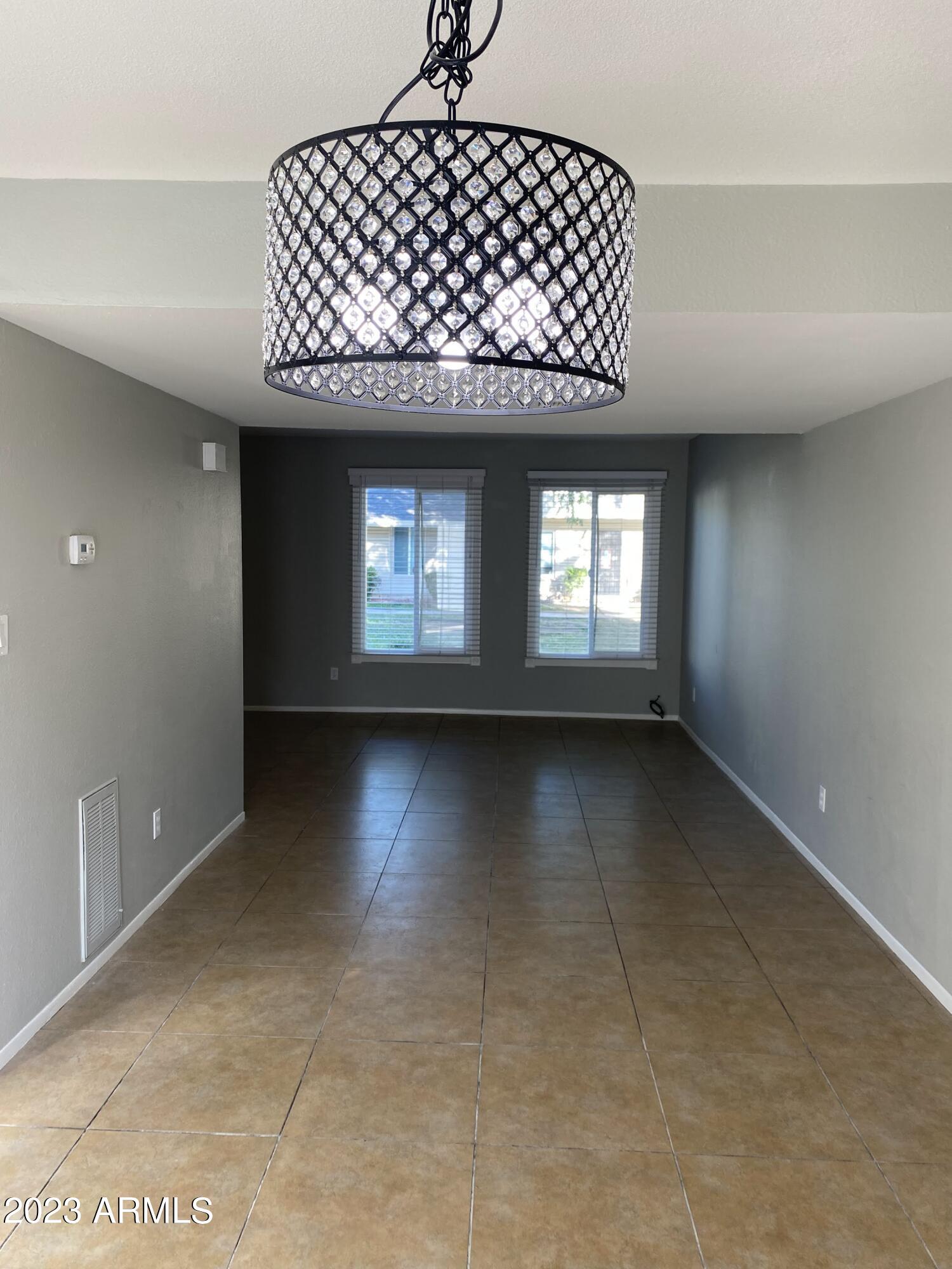 6617 South Granada Drive Tempe, AZ 85283 - Photo 14 of 20 an empty room with windows