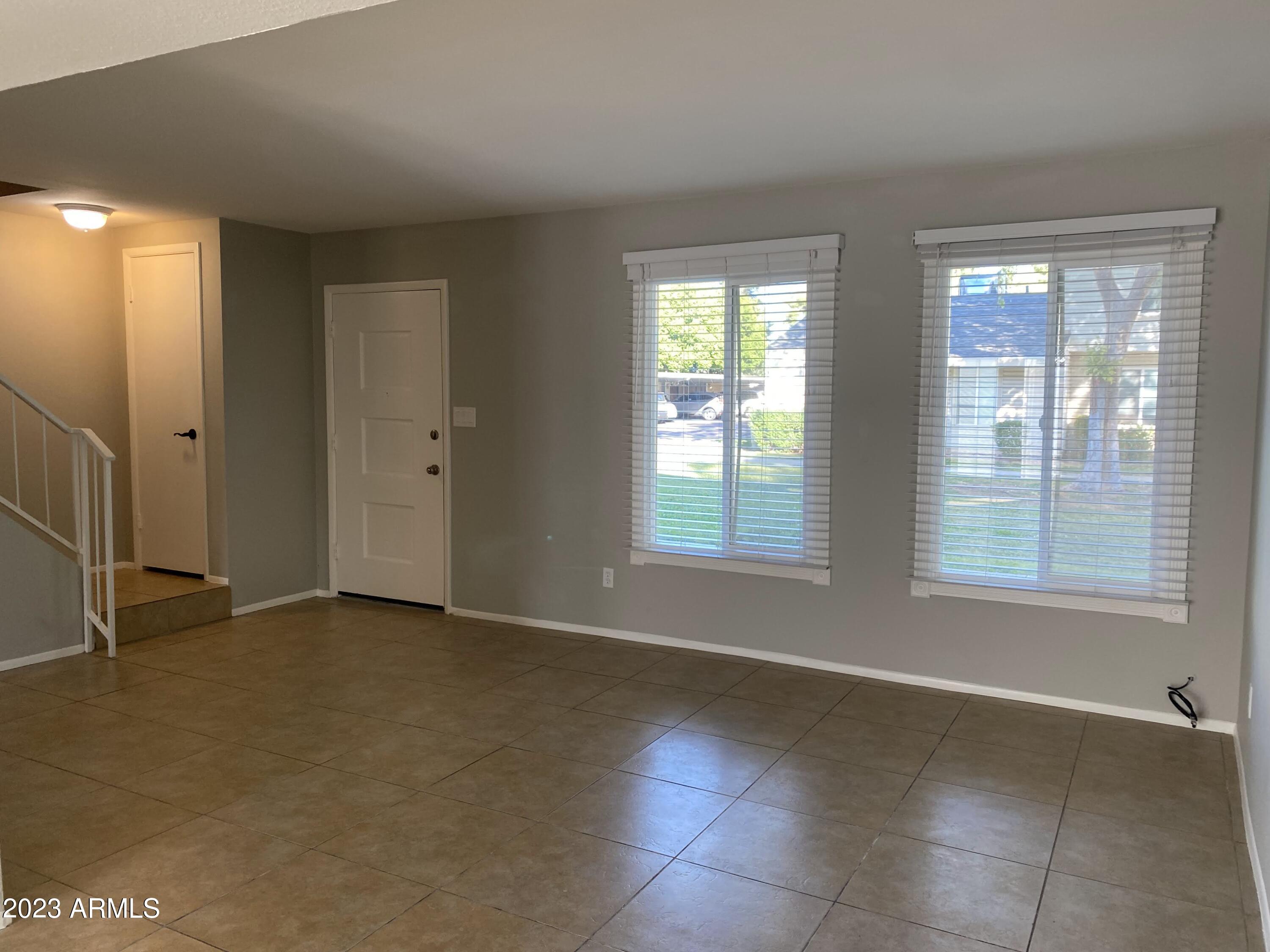 6617 South Granada Drive Tempe, AZ 85283 - Photo 15 of 20 an empty room with windows