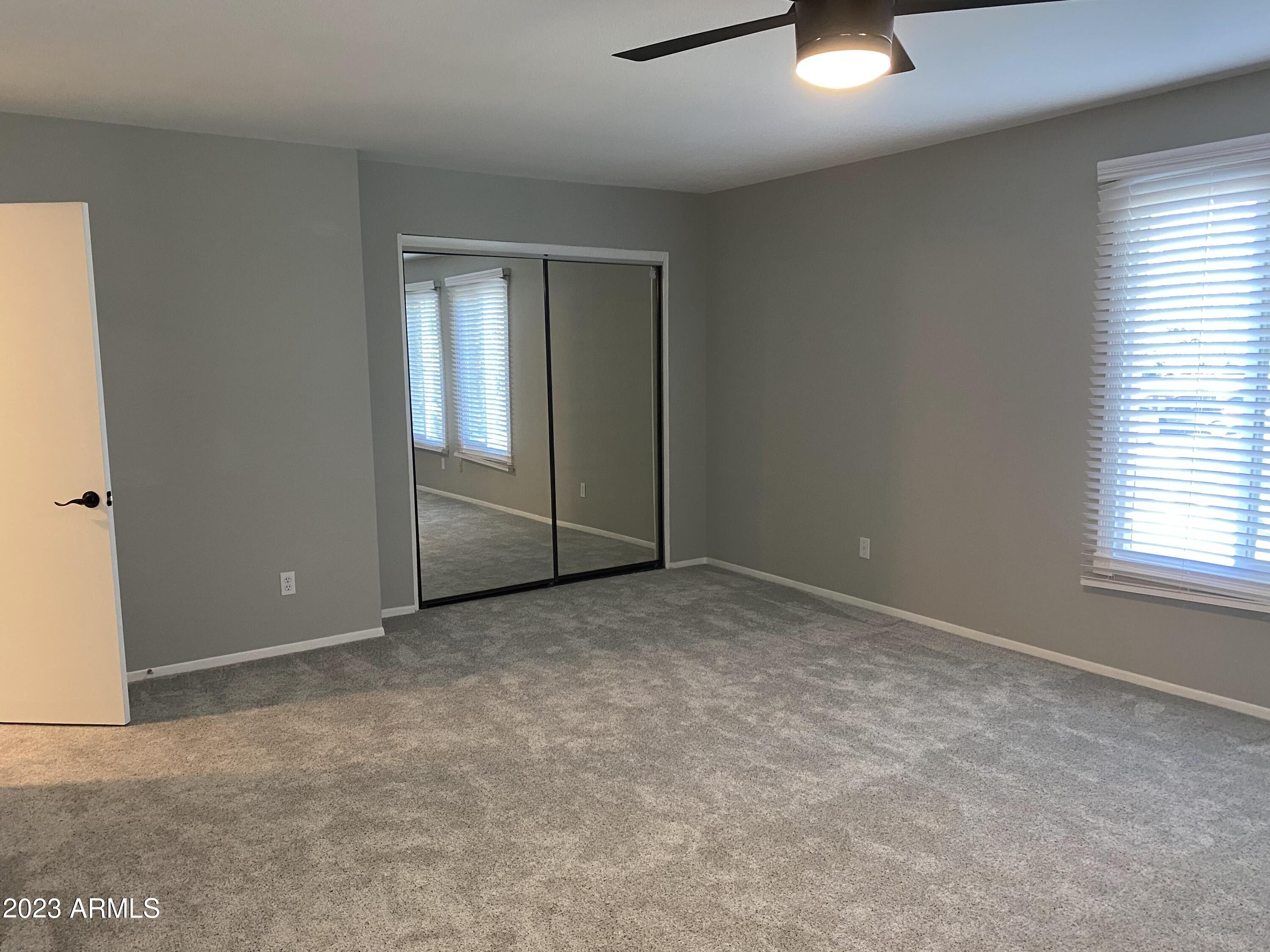 6617 South Granada Drive Tempe, AZ 85283 - Photo 6 of 20 an empty room with windows